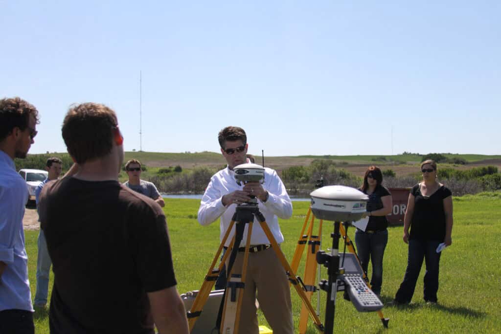 The hemisphere s320 being set on a tripod for surveying
