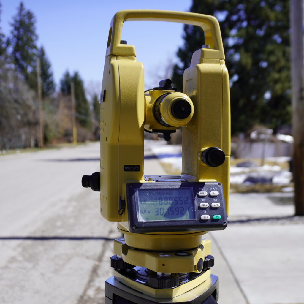 Theodolite set up outdoors for precise angle measurement in areas where GNSS signal is limited
